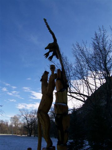 Statue of 2 Lions Trying to Catch a Bird in Flight